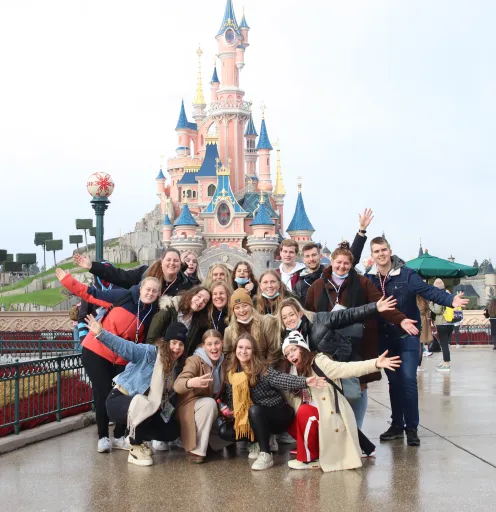 students standing in front of disney